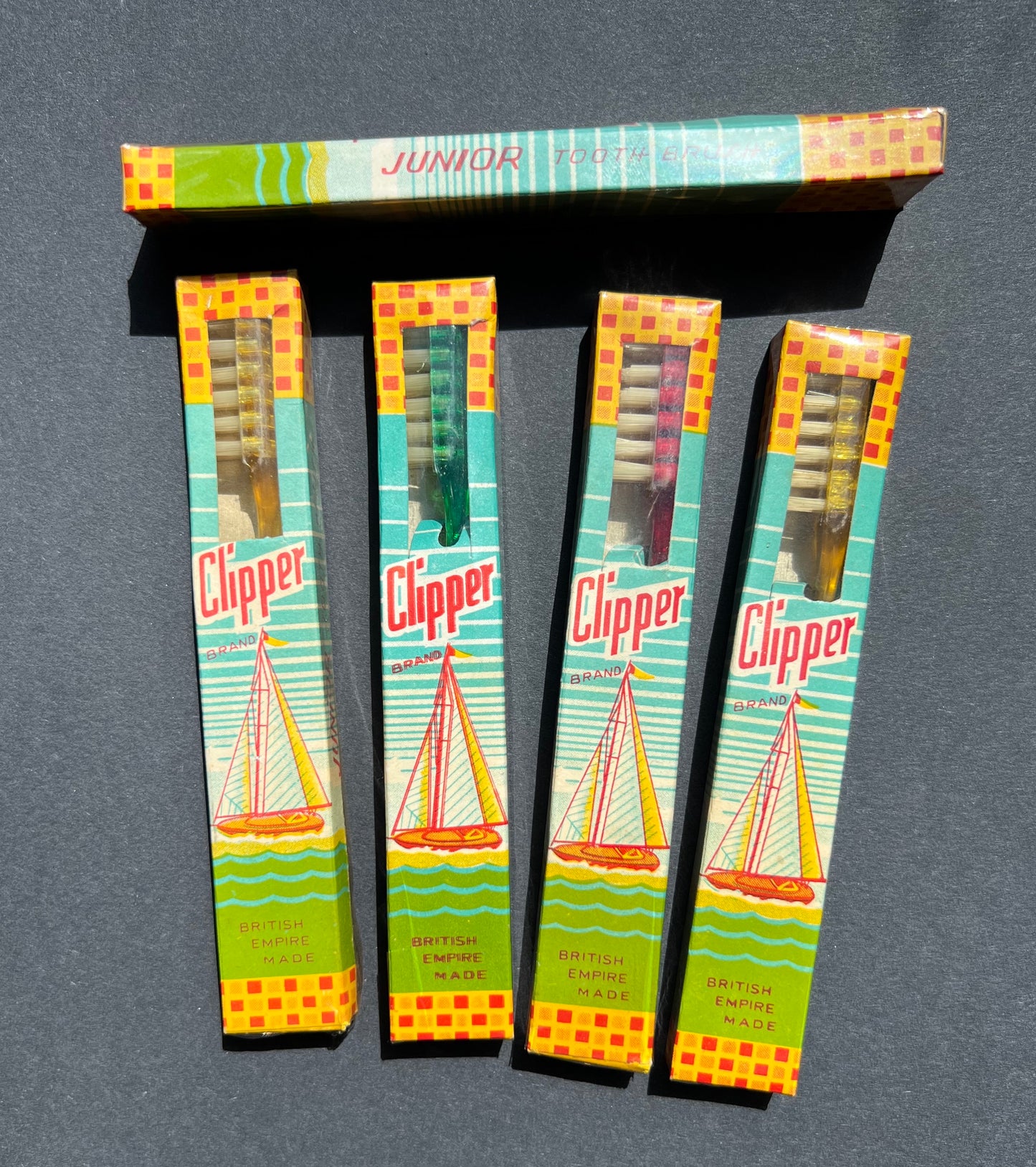 Box of 12 Vintage Junior CLIPPER Toothbrushes.