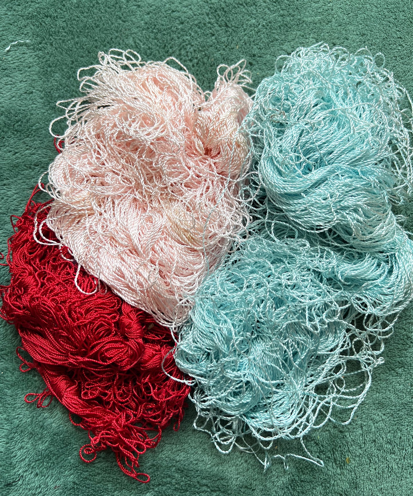 3 Skeins of Vintage Silvery Pink , Dark Red + Sky Blue 1/2mm Silky Rayon Thread -Unwound and with Some Discolouration.