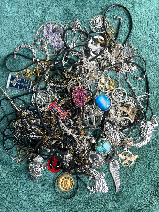 Job Lot of Tangled Up Necklaces.