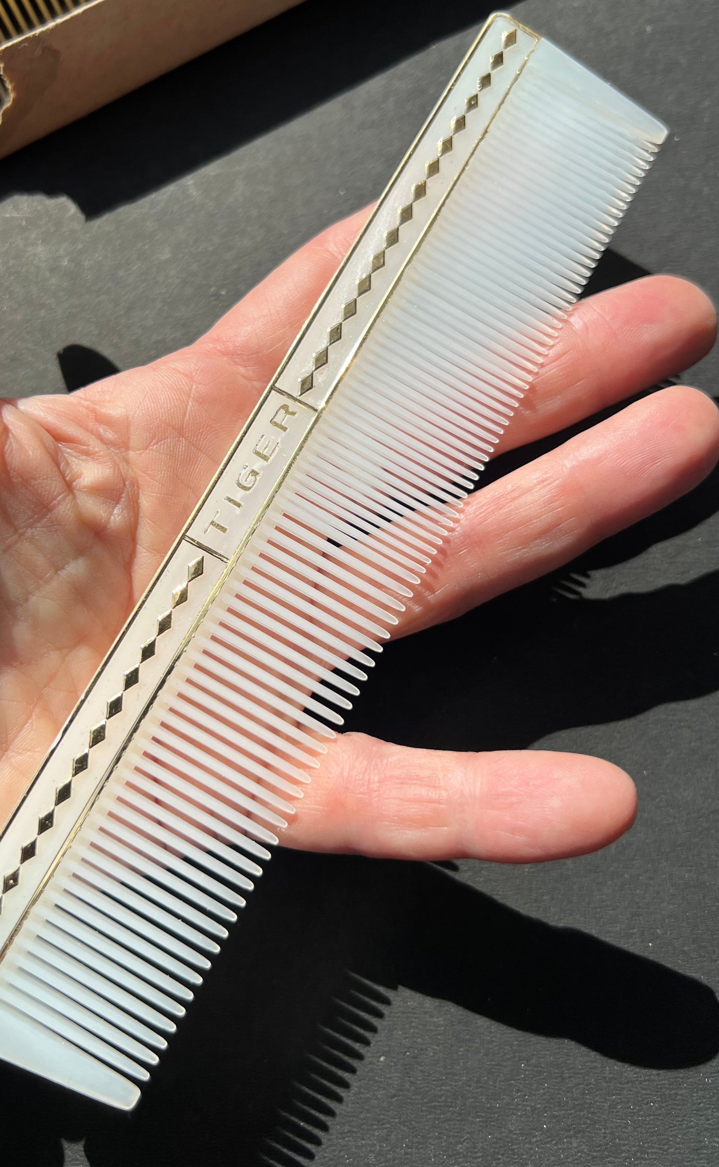 A Box of 12 Mid Century TIGER Combs. Made in Japan.