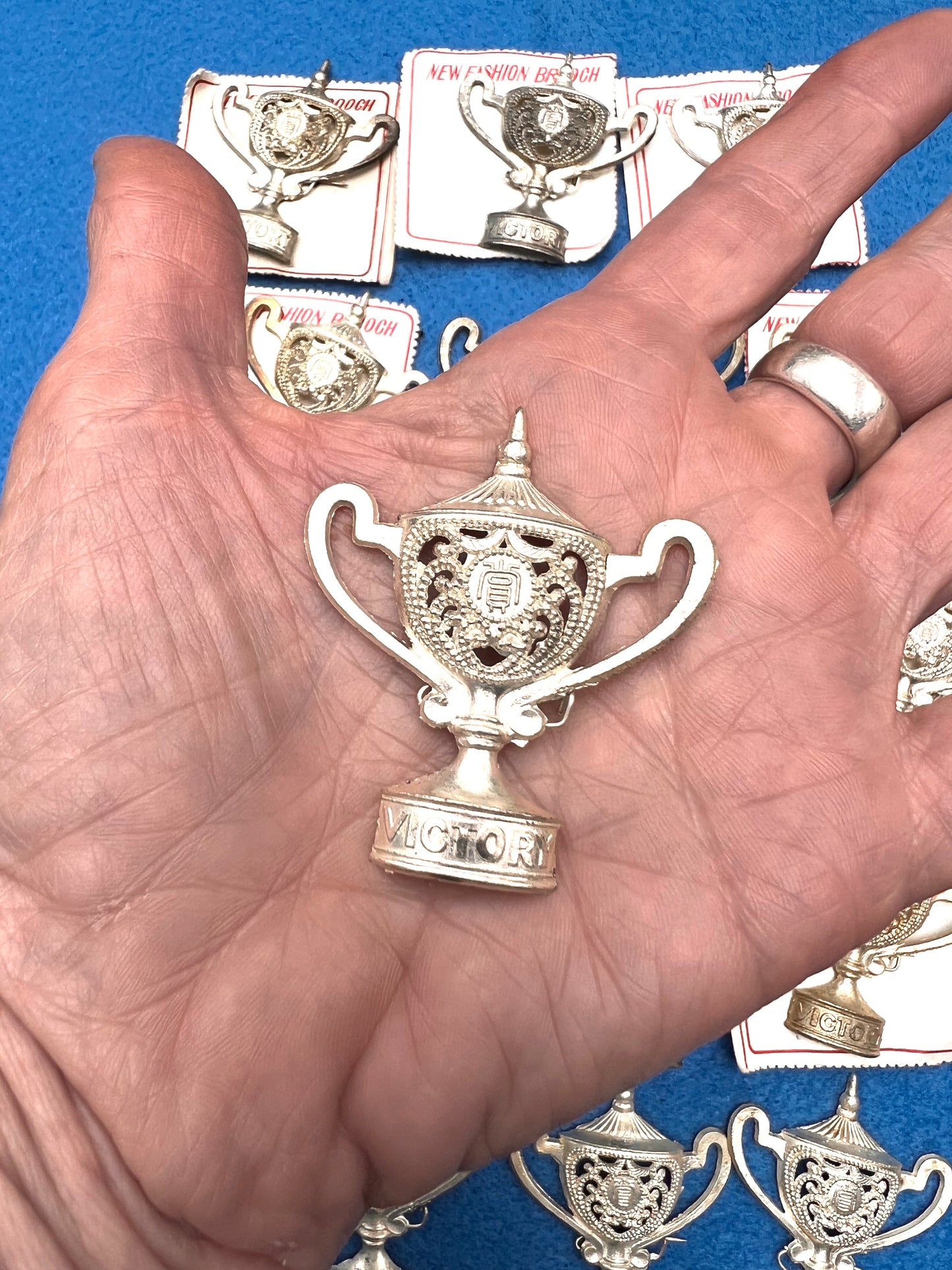 12 Tarnished "VICTORY" Trophy Brooches