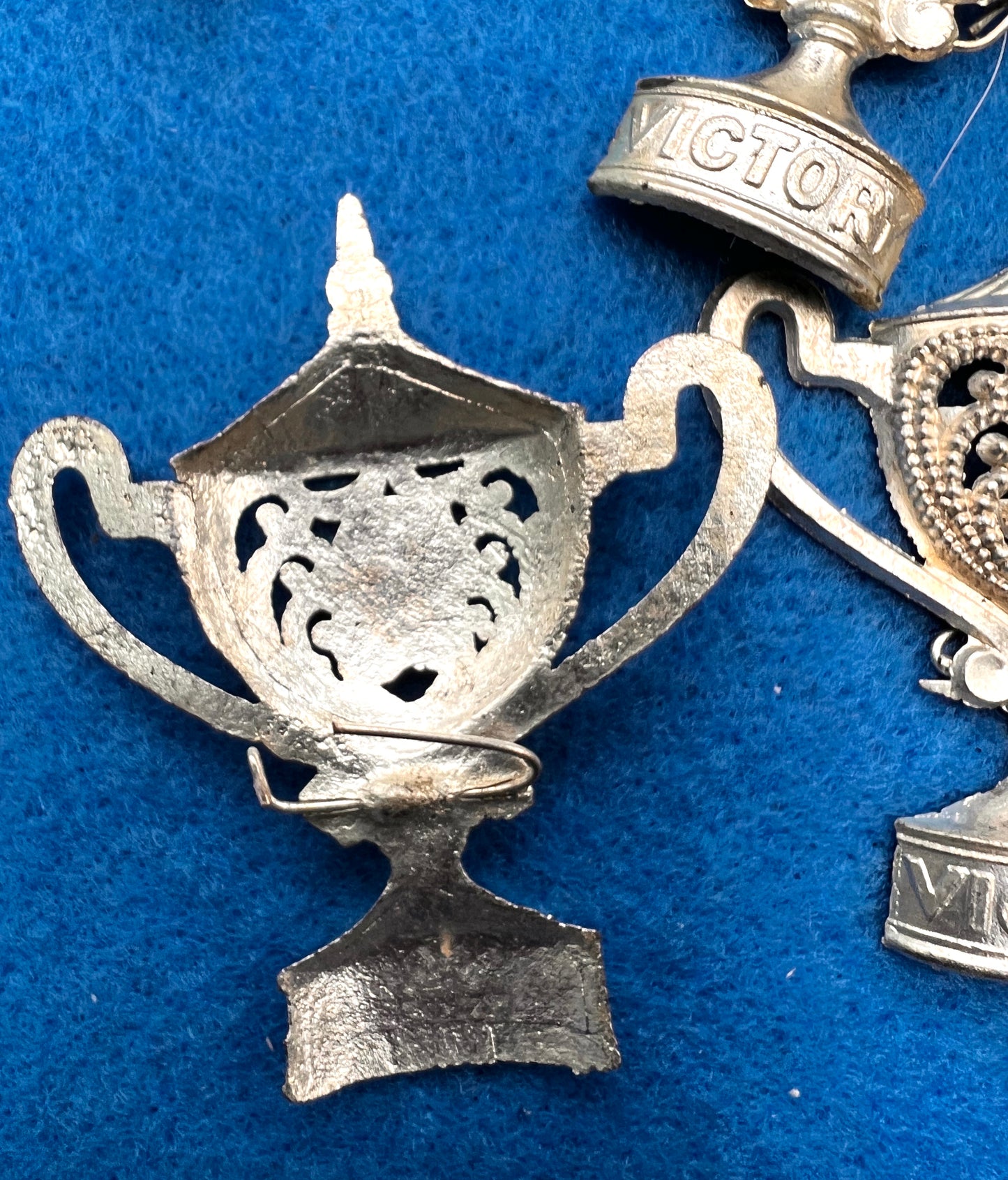12 Tarnished "VICTORY" Trophy Brooches