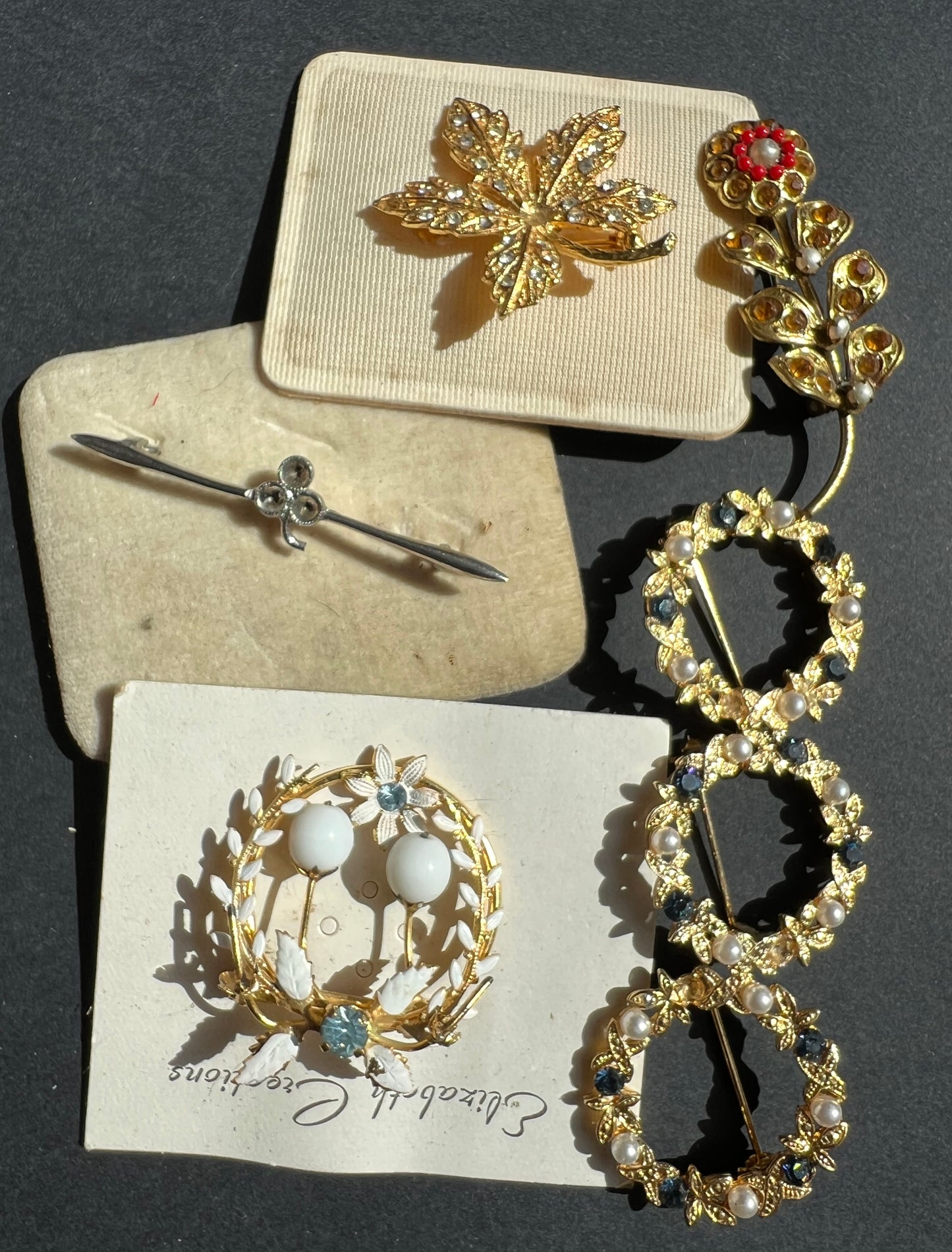 7 Vintage Brooches with the odd stone missing