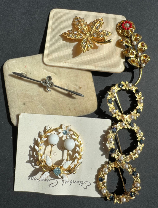 7 Vintage Brooches with the odd stone missing