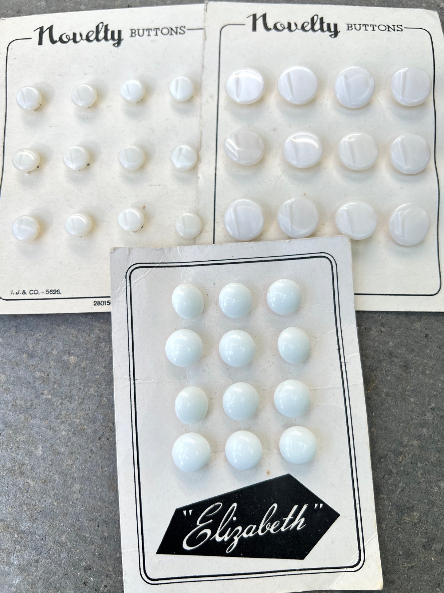 11 Sheets of Vintage Glass, Lucite and Bakelite Buttons (L)