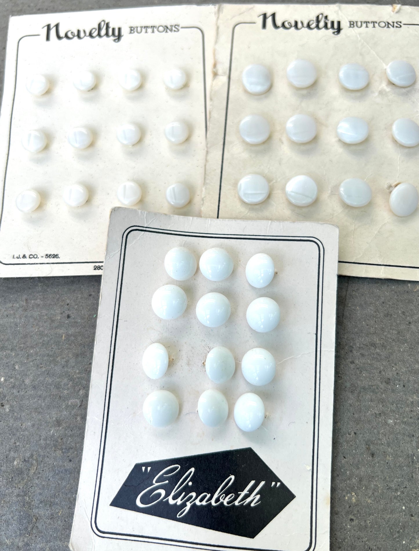 9 Sheets of Vintage Glass and Lucite White and Cream Buttons (N)