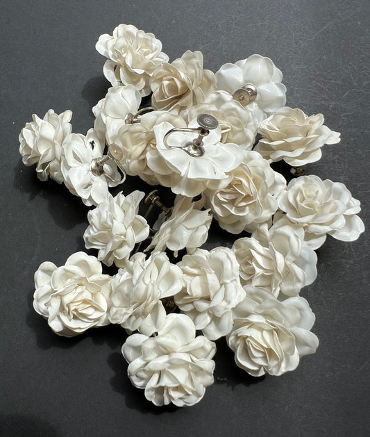11 Pairs of Vintage White Celluloid Flower Screw On Earrings - with slight splits underneath.