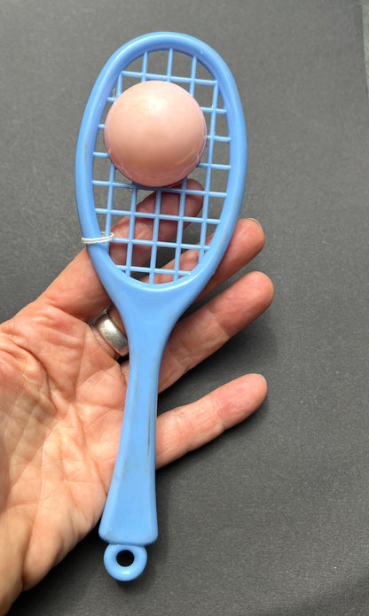 A Vintage Rattle that is a Tennis Racquet and Ball