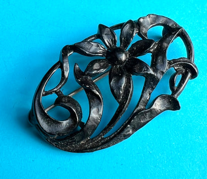 Confident 1940s Black Metal Floral Brooch  - Oval