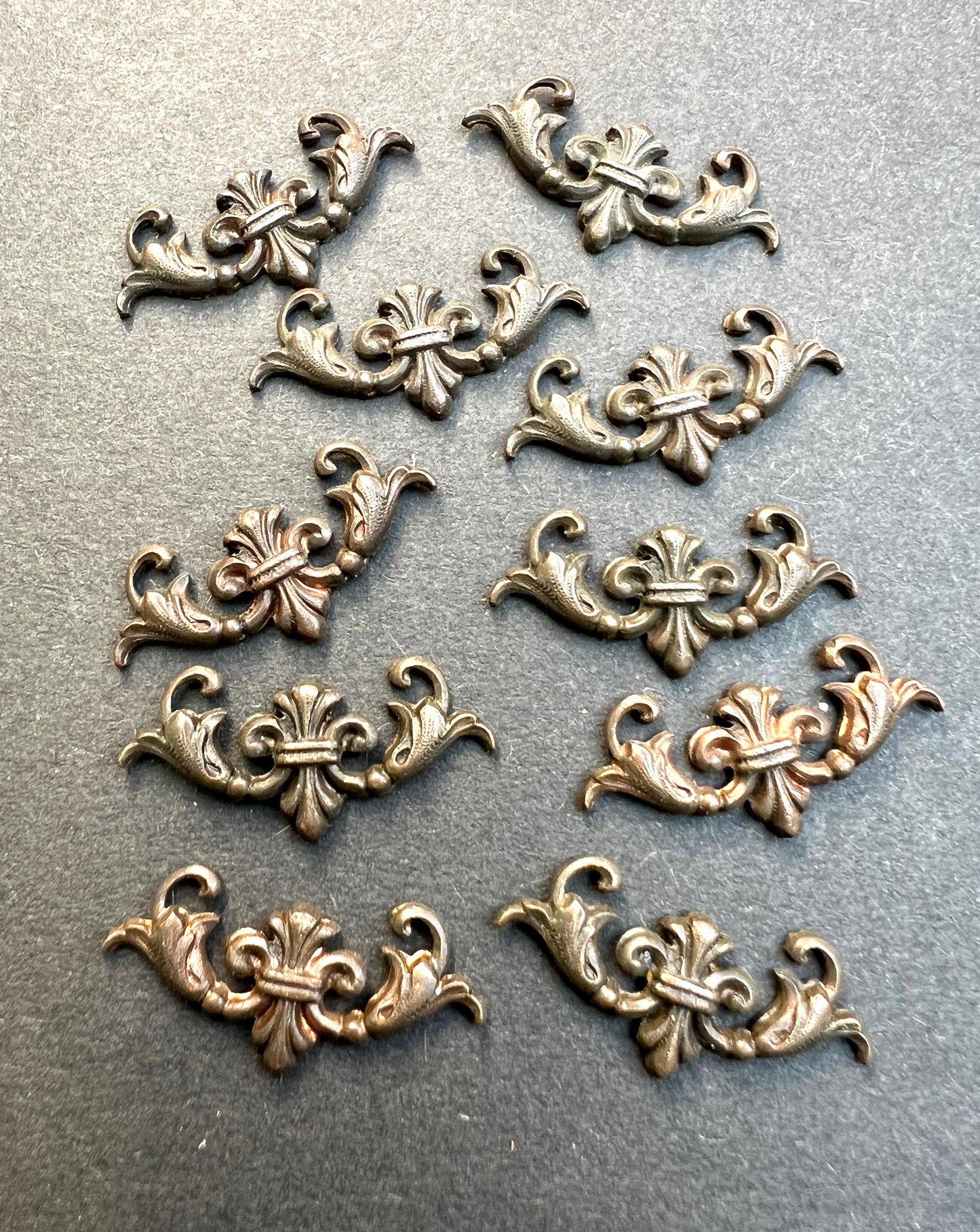 10 Early 20th Century French Decorative Brass Stampings - 2.5cm long.