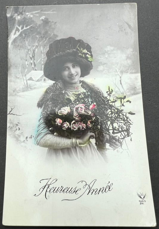 Splendid Hat, Snow & Mistletoe on this 1900s French Christmas Postcard.