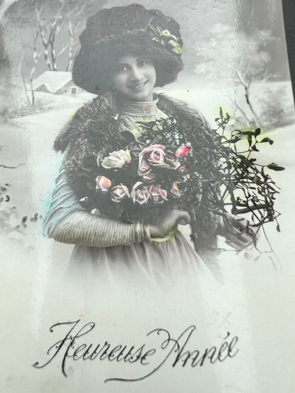 Splendid Hat, Snow & Mistletoe on this 1900s French Christmas Postcard.