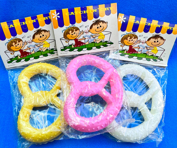 Realistically Coloured Plastic Pretzels. That Squeak. The Swagmans