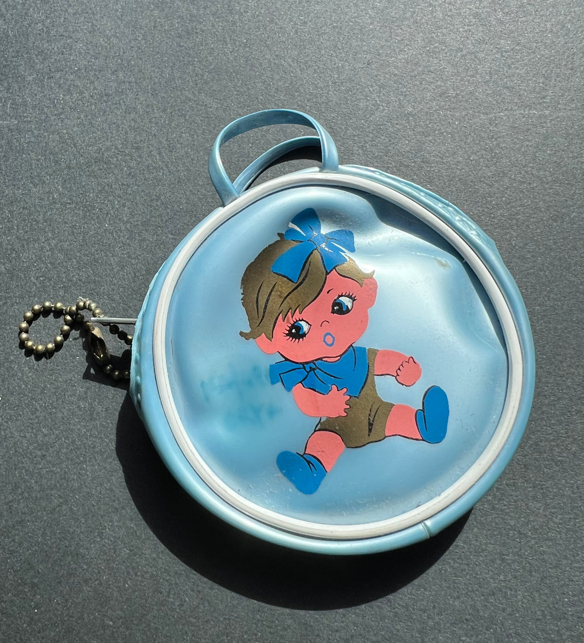 Little 1960s Purse with Surprised Child.