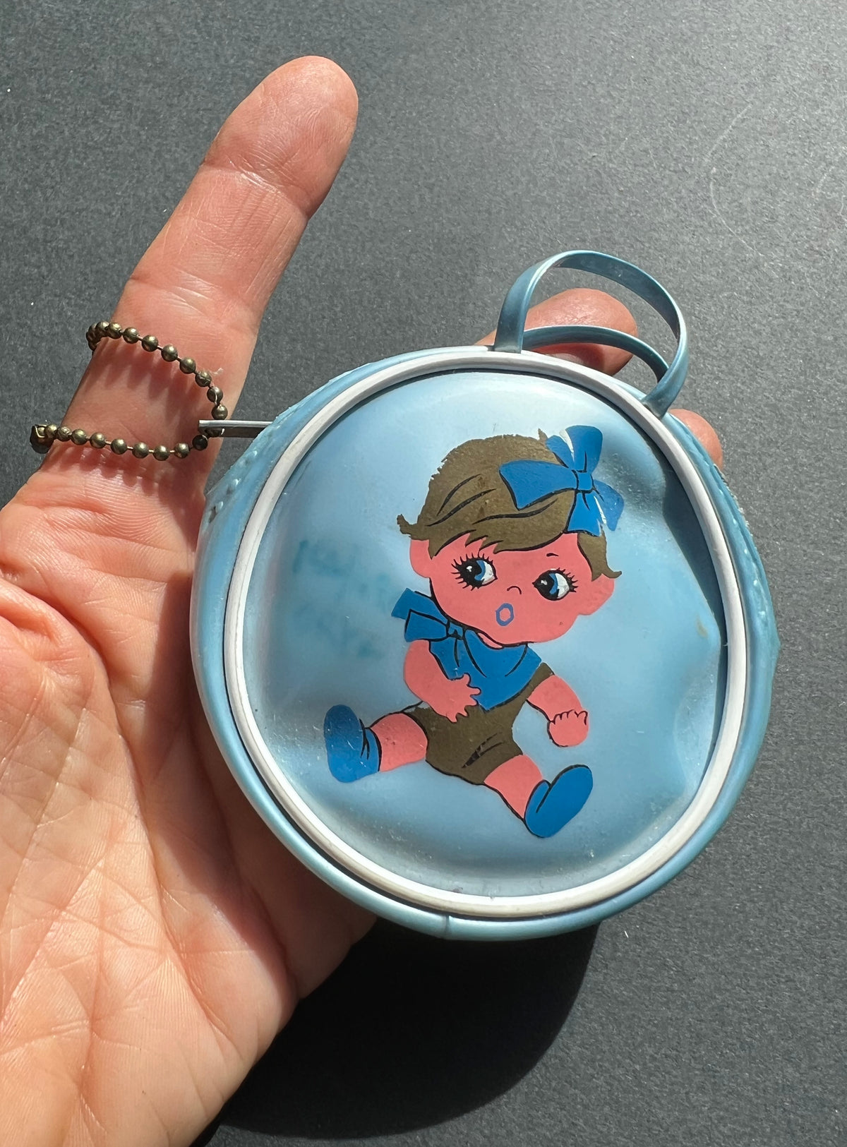 Little 1960s Purse with Surprised Child.