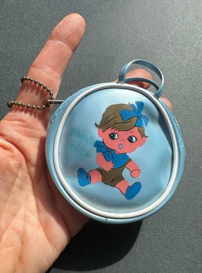 Little 1960s Purse with Surprised Child.