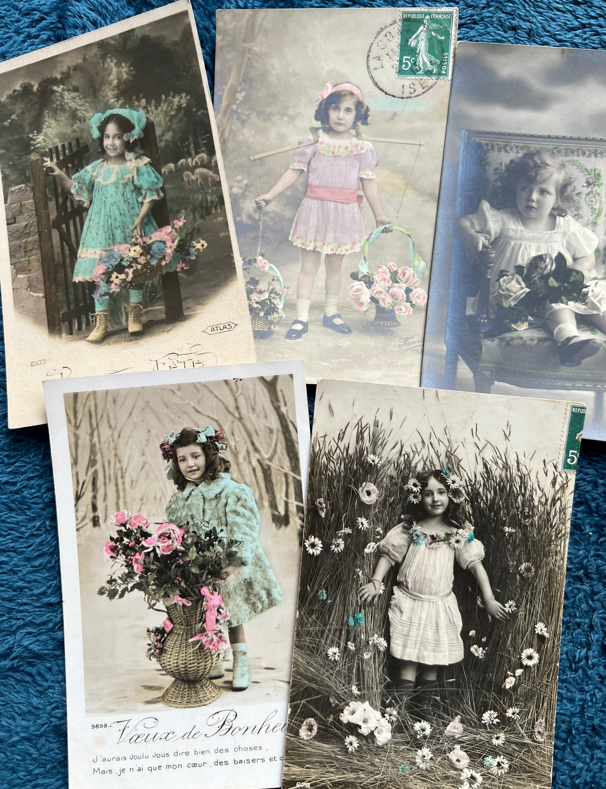 7 Pretty Early C20th French Postcards of Children with Flowers.