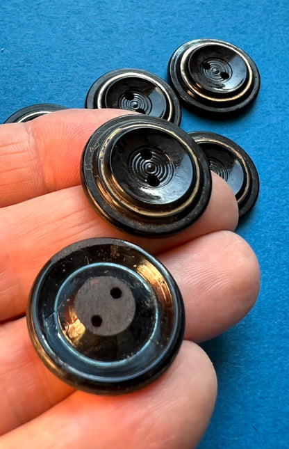 5 or 6  Early C20th Black + Gold Glass 2.2cm Buttons