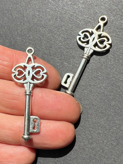 2 Mysterious Keys 4cm tall Silver Tone Charms