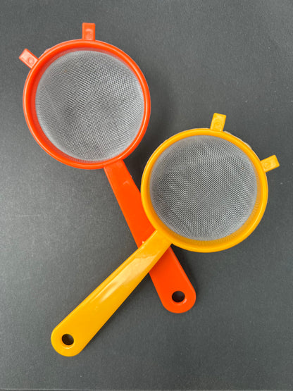 Not Aliens...But Vintage Orange Strainers