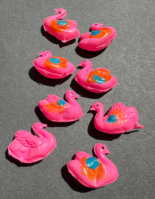 8 Pink Celluloid Swans..all a bit damaged.