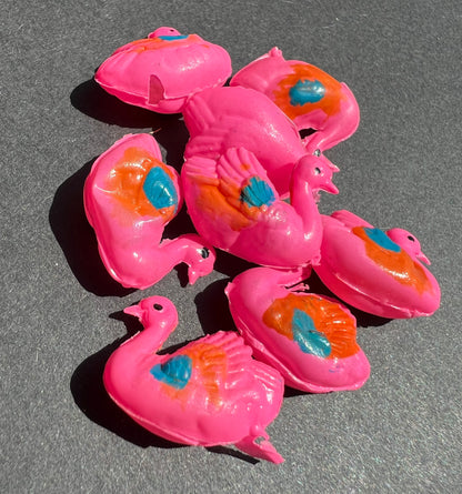 8 Pink Celluloid Swans..all a bit damaged.