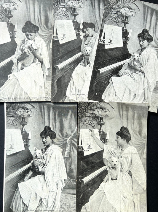 A Series of 5 Edwardian French Postcards of a Woman, Her Pet and Her Piano