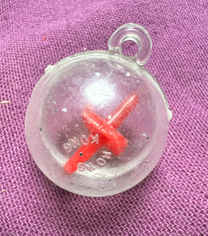 A Strange Ball Charm with Spinning Top Inside