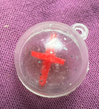 A Strange Ball Charm with Spinning Top Inside