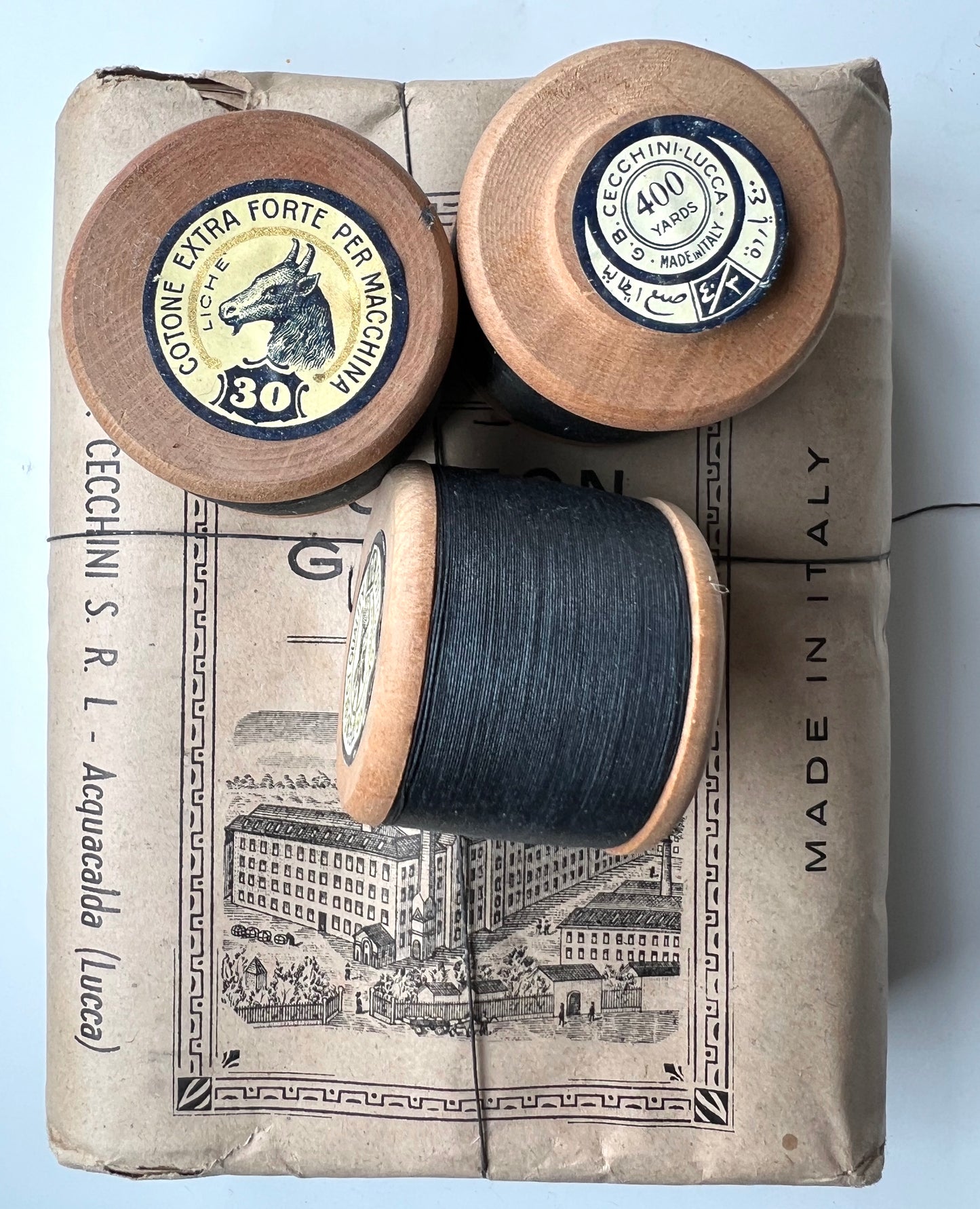 Early C20th Package of 12 Italian Wooden Spools of Black Sewing Thread.