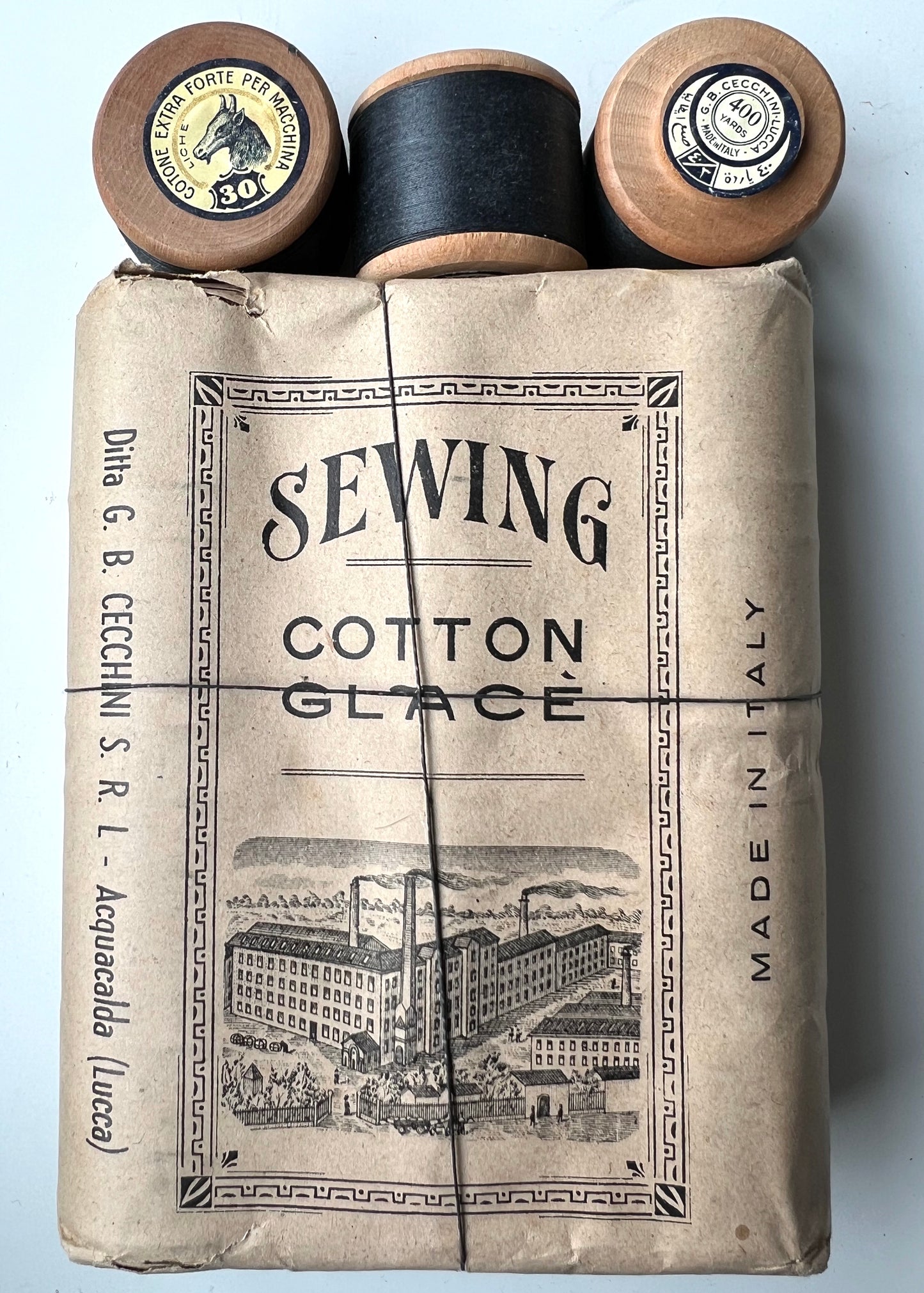 Early C20th Package of 12 Italian Wooden Spools of Black Sewing Thread.